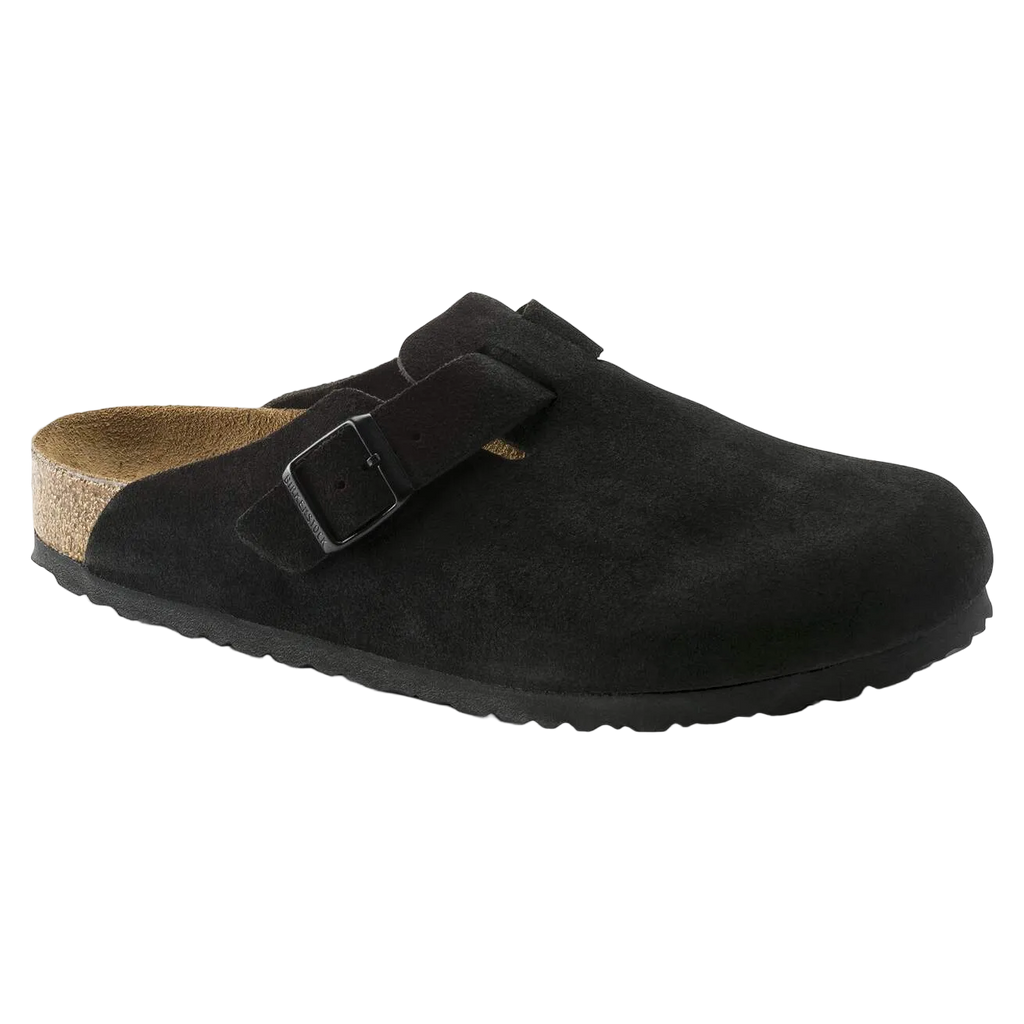 Black suede clog shoe with a strap on a white background
