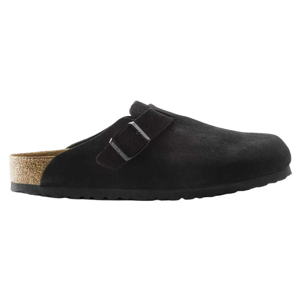 Black suede clog shoe with cork insole on a white background