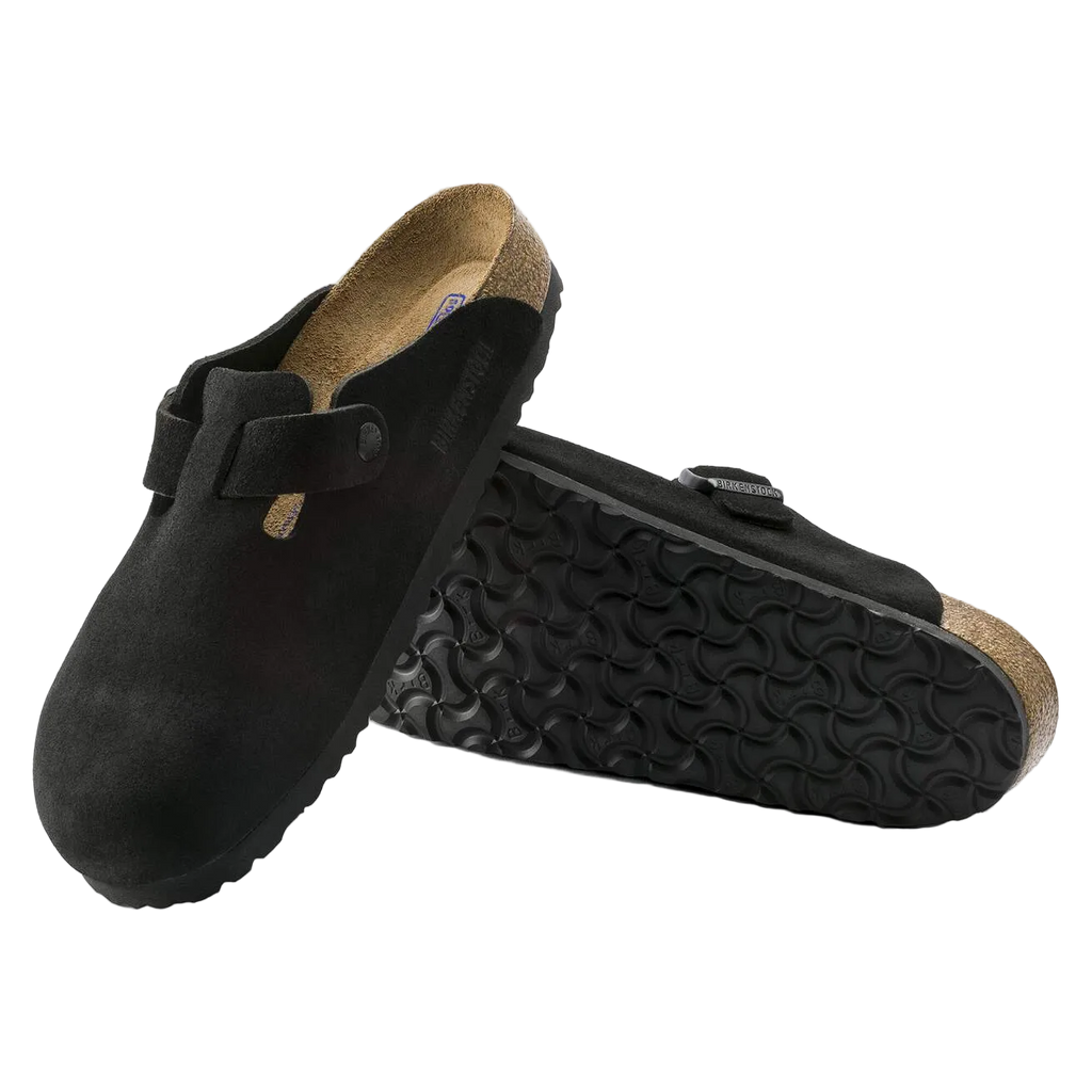 Black clogs with cork sole on a white background
