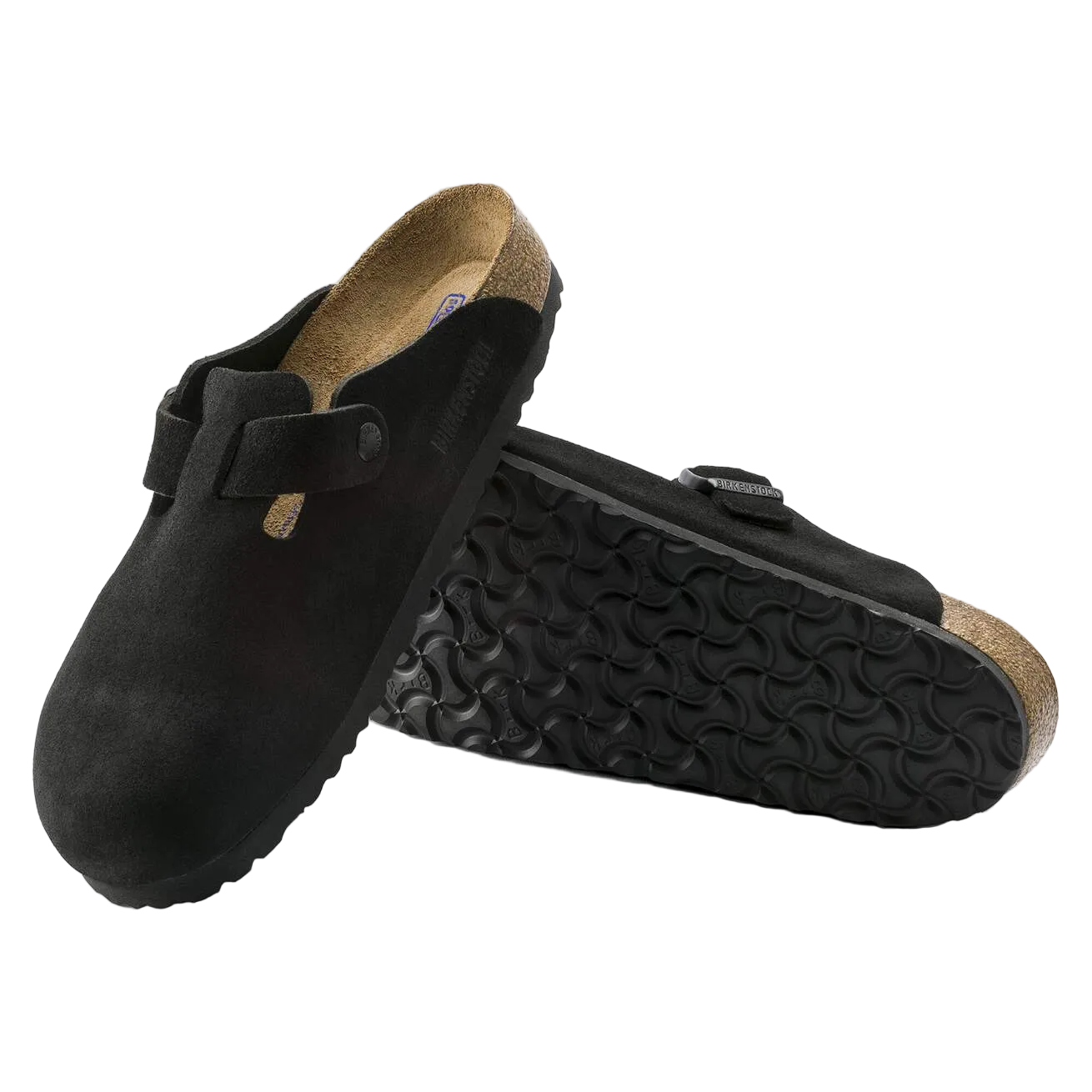 Black clogs with cork sole on a white background
