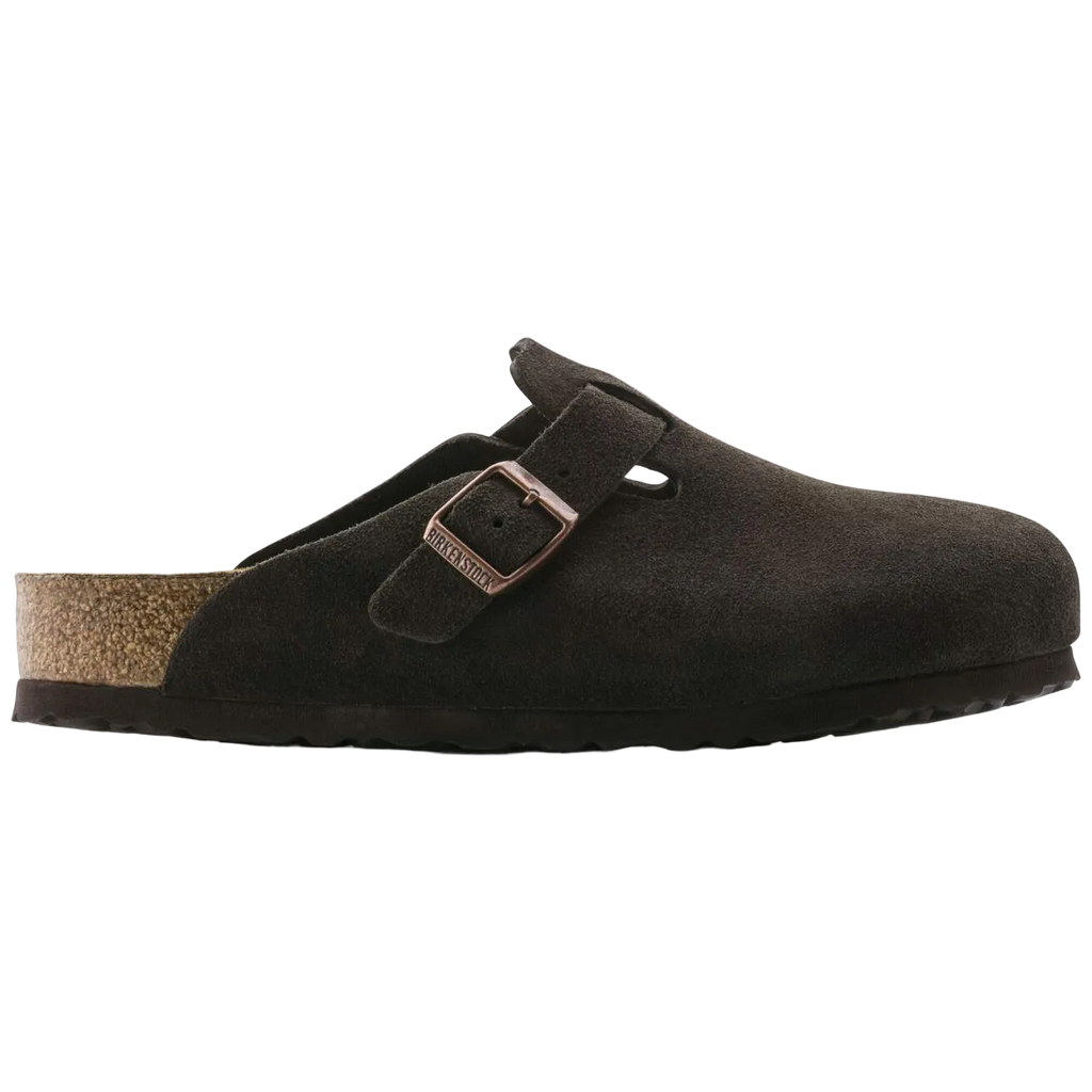 Brown suede clog shoe with a buckle on a white background