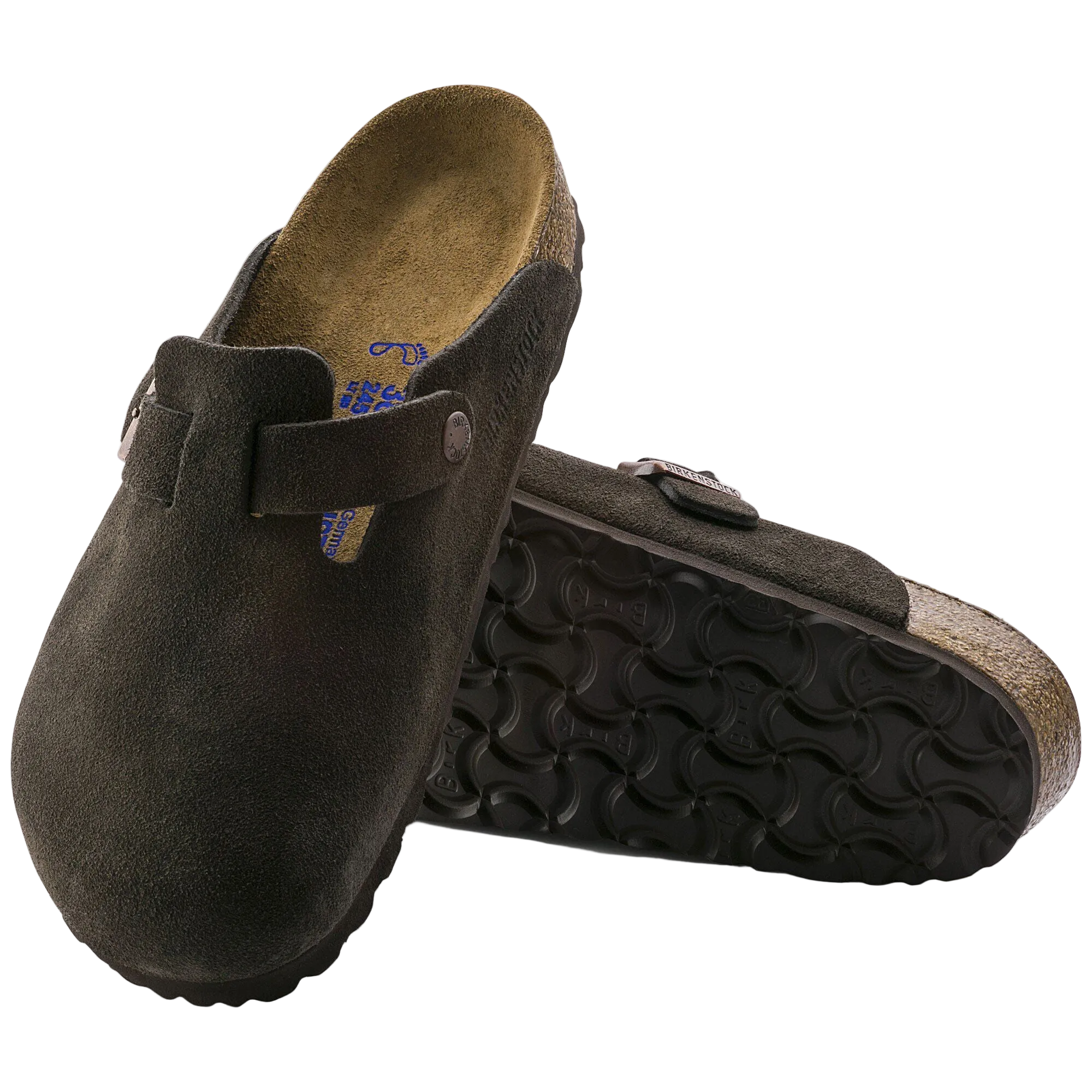 Brown suede clogs with cork sole on a white background