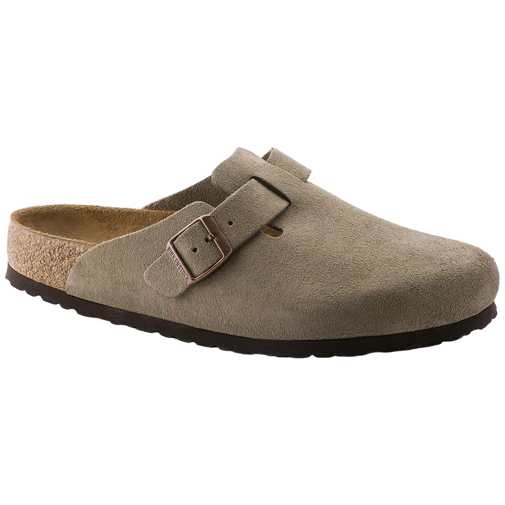 Brown suede clog shoe with a buckle on a white background