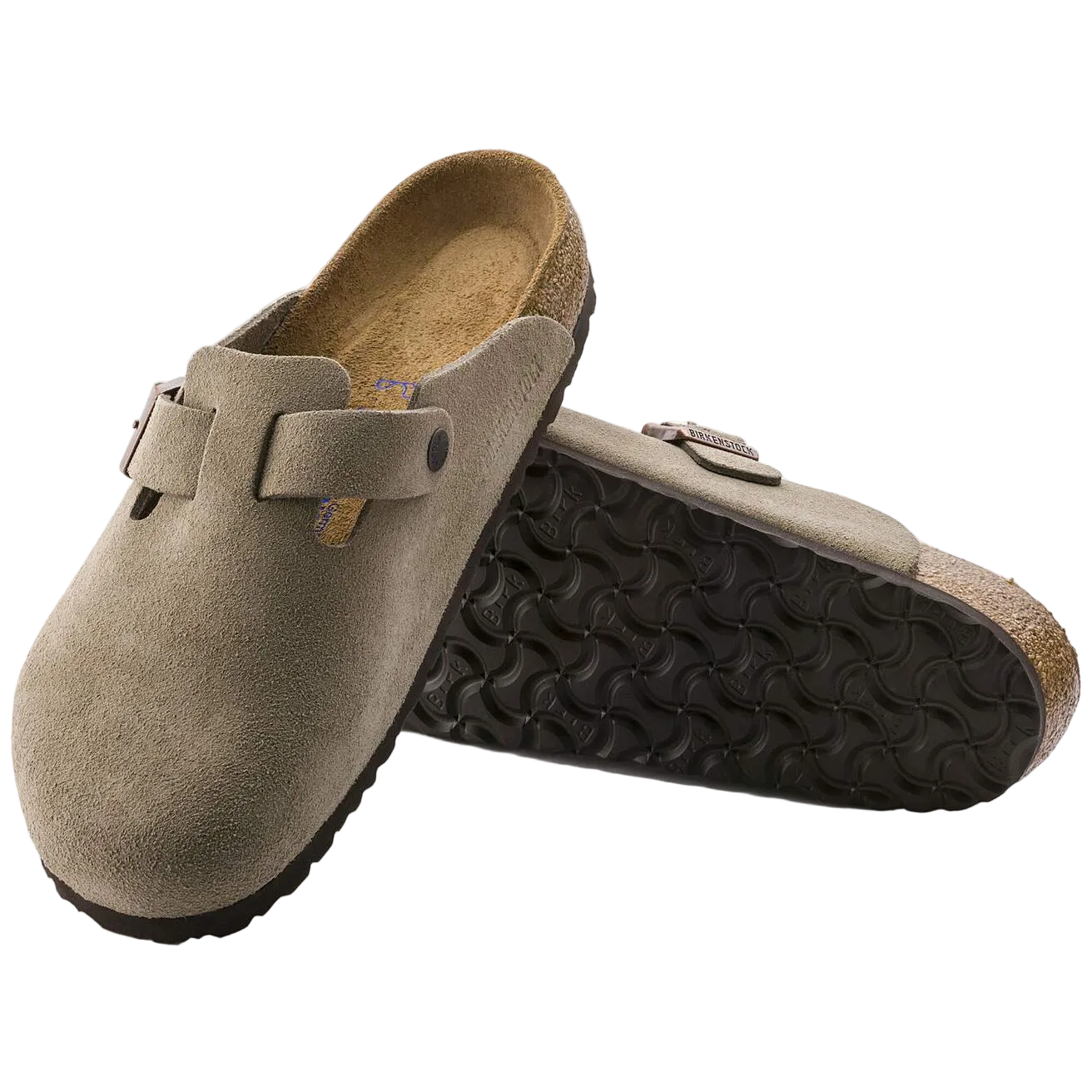 Pair of brown suede clogs with black soles on a white background
