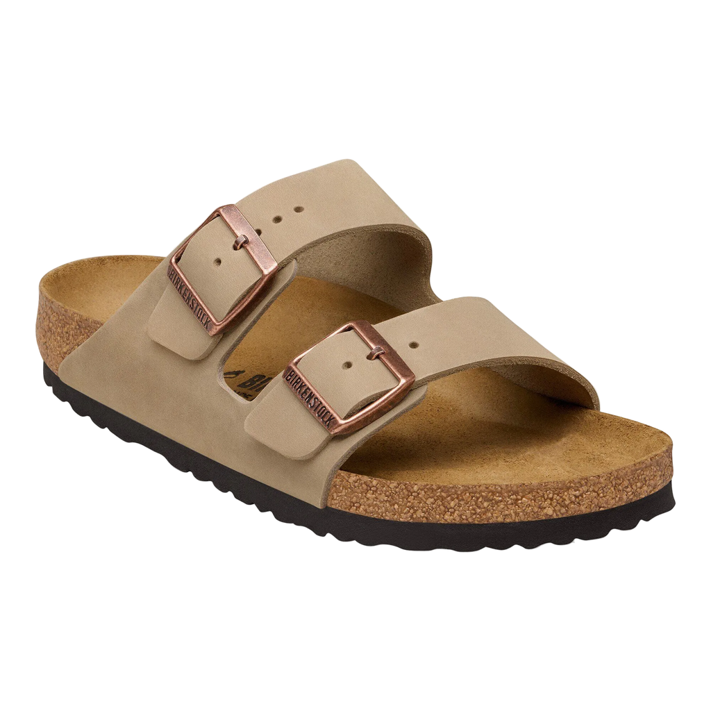 Beige sandal with brown buckle on a white background
