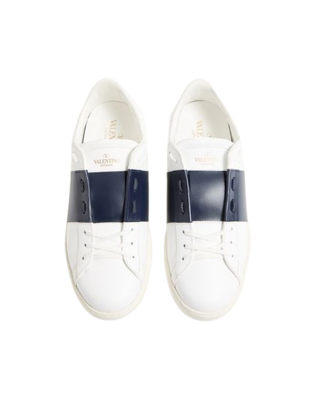 White sneakers with navy blue accents on a white background
