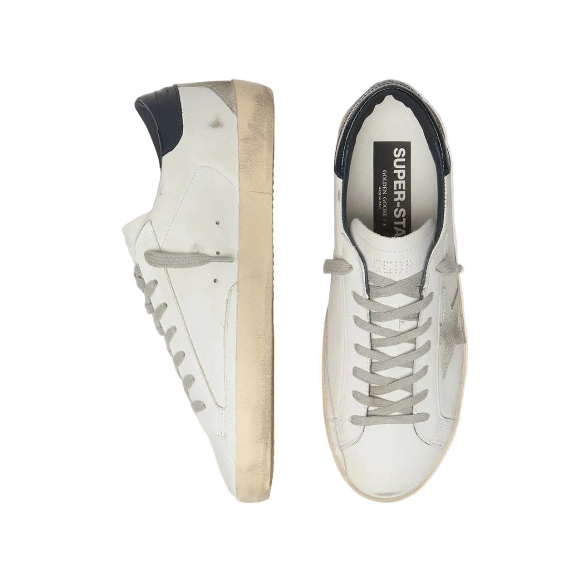 White sneakers with a visible brand logo on a light gray background