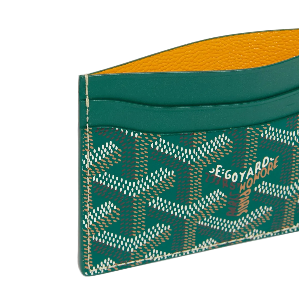 Green cardholder with patterned design on a white background