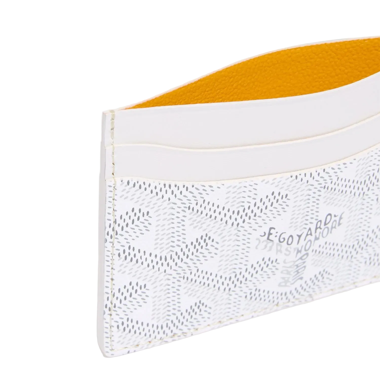 White cardholder with yellow interior on a light gray background