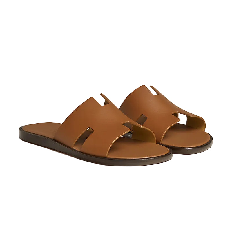 Pair of brown sandals on a light gray background